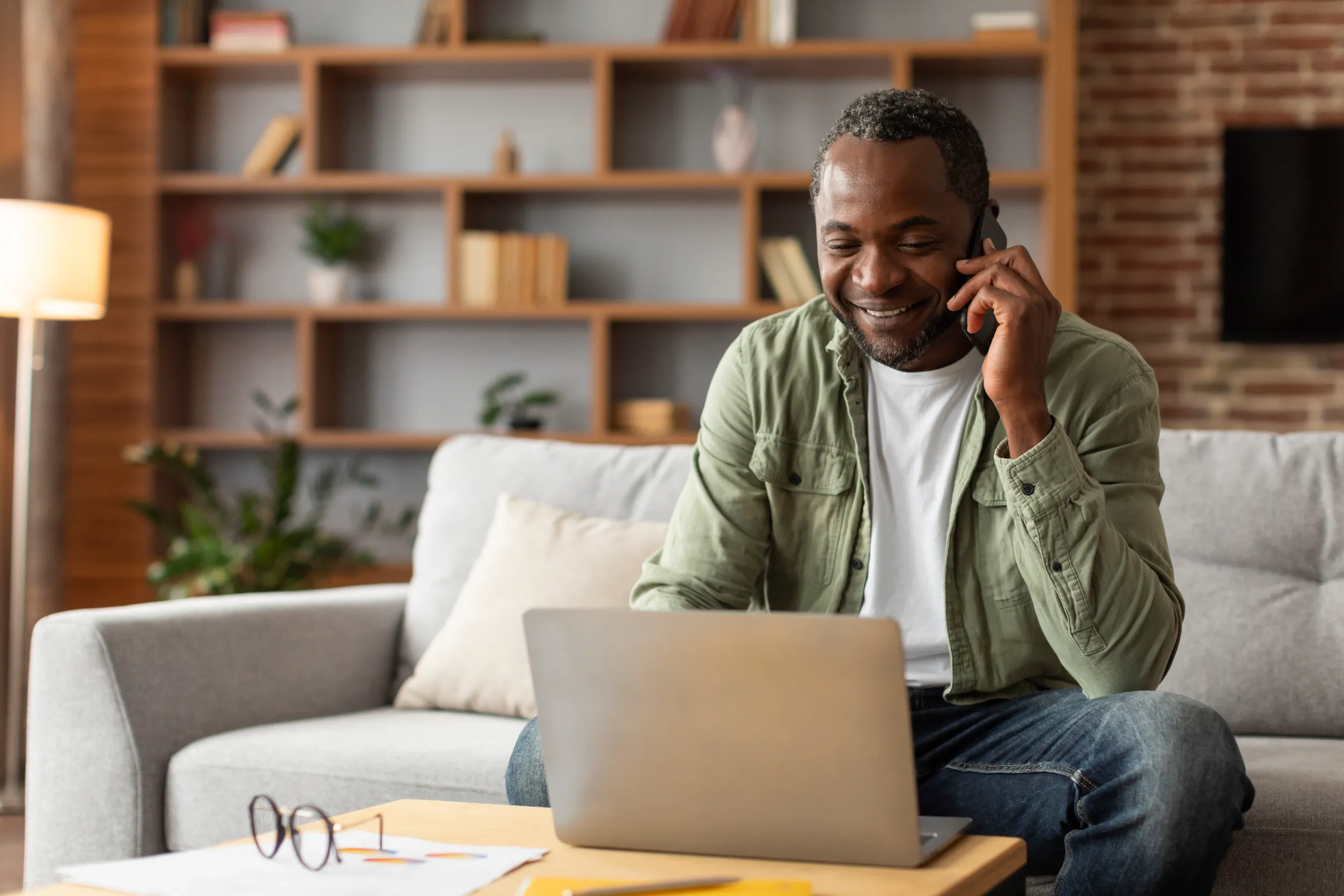 Man smiling at laptop
